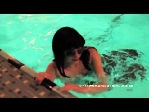Jessica swimming in pantyhose and sunglasses