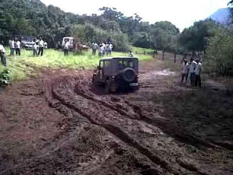 A slightly modified Mahindra Thar getting stuck and eventually getting out