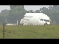 Alabama cargo plane crash: Smouldering wreckage in daytime