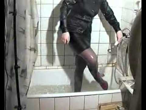 woman showers fully clothed