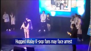 Malay girl fans could face arrest for hugging K-pop boy band / YTN