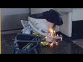 Burning device filmed on tube carriage at Parsons Green stati...
