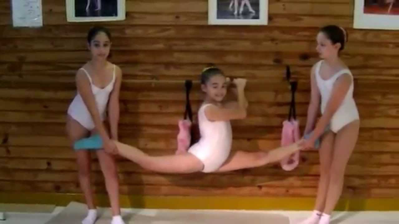 Spreading legs doing splits teen