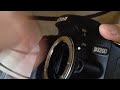 Видео Comment mettre un objectif sur son Nikon D3200