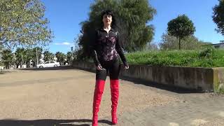 Victoria Devil. Walking Gothic Corset, Black Catsuit And Red High Heel Boots.