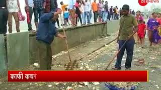 High tide in Mumbai spills up piles of garbage on the roads High tide in Mumbai spills up piles of garbage on the roads