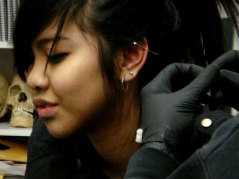 Hello there :DI ' m Kristina , and this is me getting my industrial piercing 
