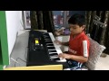9 year old boy playing Summer of 69 on keyboard