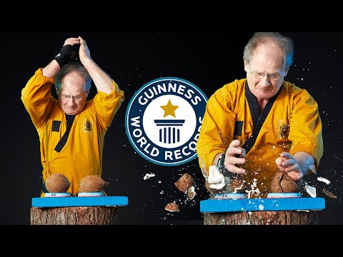 Play this video Most coconuts smashed in one minute - Guinness World Records