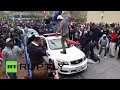 Baltimore: Protesters smash cars, clash with police