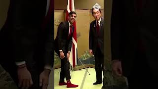 Shows Off Red Team Socks To Charm Japanese Pm