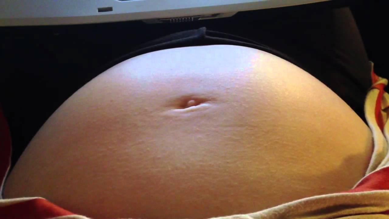 Camgirl pregnant belly movements