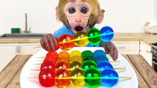 Monkey Baby Bon Bon eats rainbow jelly with puppies and bathes with ducklings in