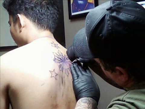 tattoo+pinoy+real tattoo+p.r.. FILIPINO PRIDE: 3 stars and a sun tattoo.