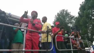 Mbuyiseni Ndlozi leading the crowd in singing Azania Mbuyiseni Ndlozi leading the crowd in singing Azania
