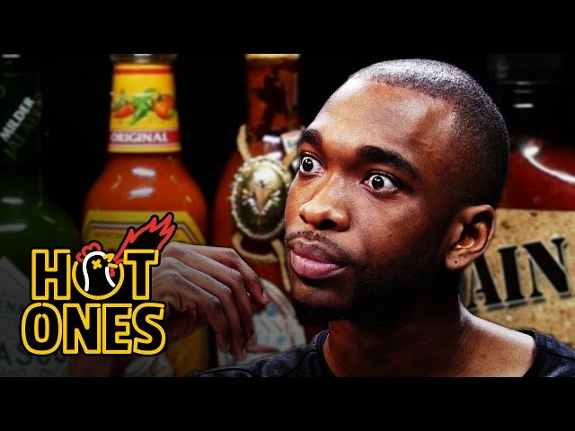 Jay Pharoah Has a Staring Contest While Eating Spicy Wings -