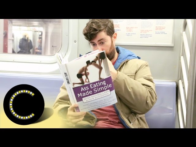 Reading Books With Outrageous Covers On The Subway - Video