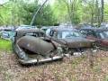 Abandoned cars in forgotten junkyard