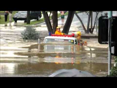 Fire truck drives through flood waters in Eltham Melbourne Australia on