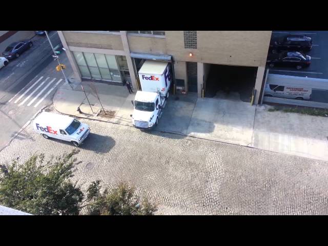 Fedex Truck Driver Performs Perfect Reverse Parking Into Narrow Garage - Video