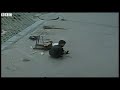 Chinese boy unhurt after car runs over him - BBC News