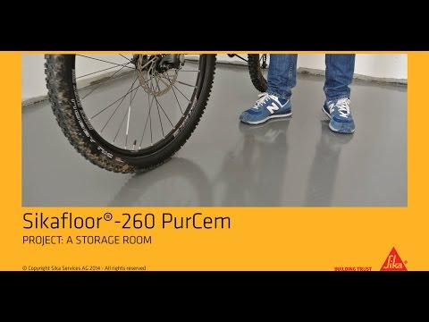 Professional application of Sikafloor-260 PurCem Glossy in a storage room