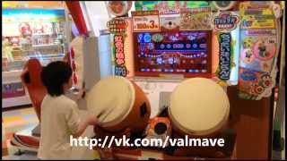 Japanese Kid Playing On Taiko Drums In Arcade Japanese Kid Playing On Taiko Drums In Arcade