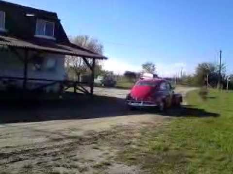 Volvo Pv 544 Sport from the year 1963 driving on mud terrain