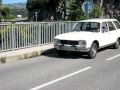 Peugeot 504 Break driving on Pont de St. Croix, France