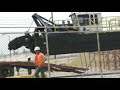 7012 HP Versi-Dredge is unloaded from a flatbed.