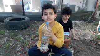 Azra Ile Emir Ali Çiçek Ekti.toprakla Oynadilar.them Planted Flowers And Played With The Soil.