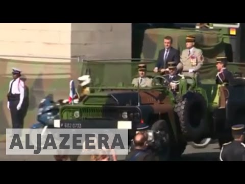 Macron seeks to charm Trump at Bastille parade in Paris