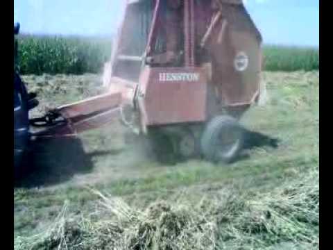 Hesston Square Baler. Baling hay in Novo Selo