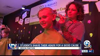 Students shave their heads for a good cause