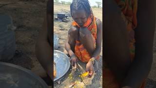 Turkana Tribe Village Women Cleaning Chicken Stomach In The Desert