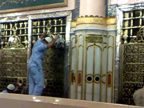 cleaning of Golden cover (Jaali ) of Roza-e Mubarak of Prophet...
