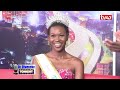 Beauty pageant winners (Cindy Isendi and Ivy Triza) give Dr Ofweneke tips on walking the runway