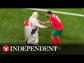 Morocco player celebrates by dancing with his mother after World Cup win