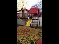 Mom skateboards down slide into leaves