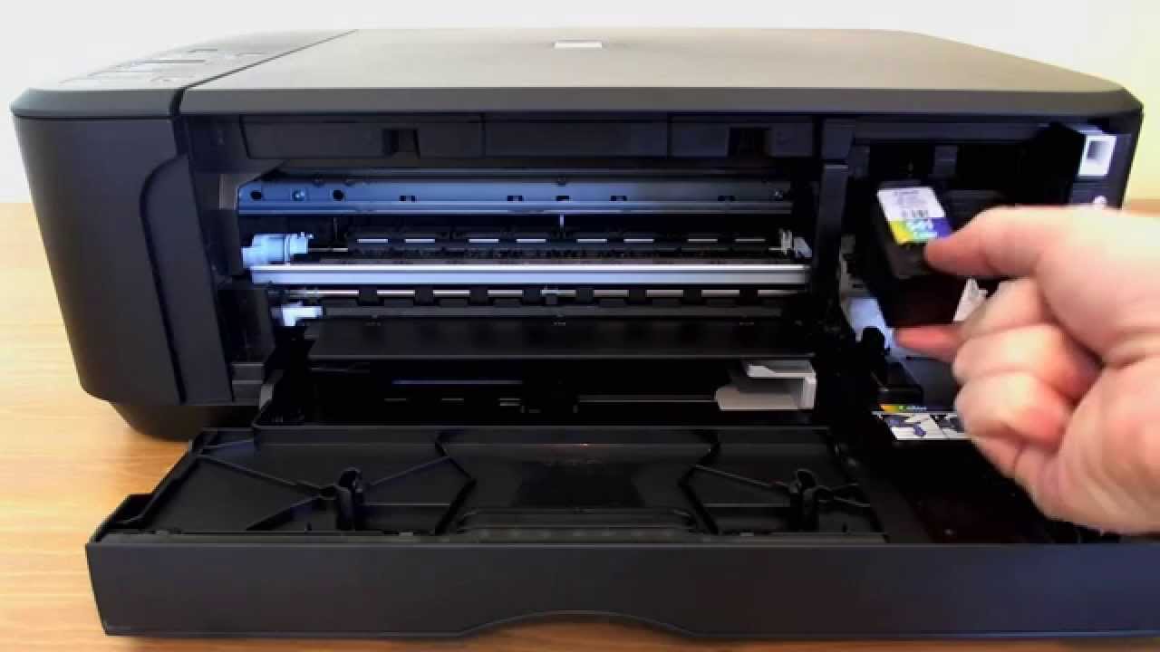 How to change the ink on an Epson Stylus NX215 printer?