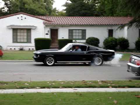 1967 mustang with a 342 Ford Racing Stroker lights it up on the street