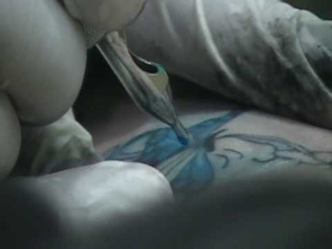 My foot tattoo 6 08 09 My daughter filming my tattoo of butterfly 