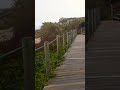 Walking in silence 🌊 #darknomad #travel #walking #silence #nature #beach #boardwalk #coast #solo