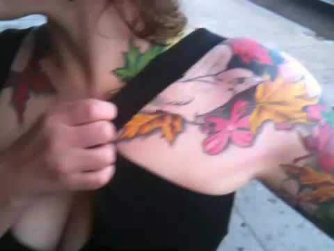 Birds and flowers arm sleeve at guru tattoo.