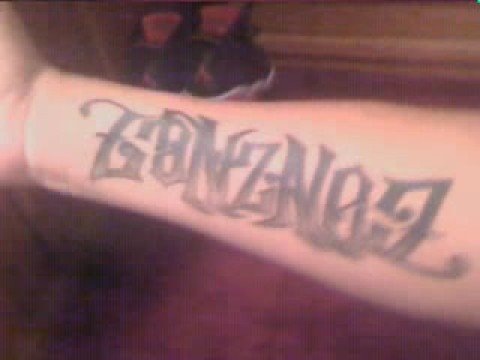 Ambigram Tattoo of my last name on my forearm