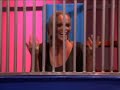 Jenny McCarthy being dunked inside a dunk tank on television