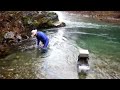 John Rose operating an underwater suction machine - Gold Prospecting