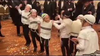 Group Of Kids Dressed As Breslov Chasidim, In a very happy dance at a wedding