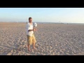 David Beckham kicks ball in bin on the beach bare foot