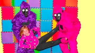 Gorillas Escape and Play with the Assistant in Her Bounce House Gorillas Escape and Play with the Assistant in Her Bounce House